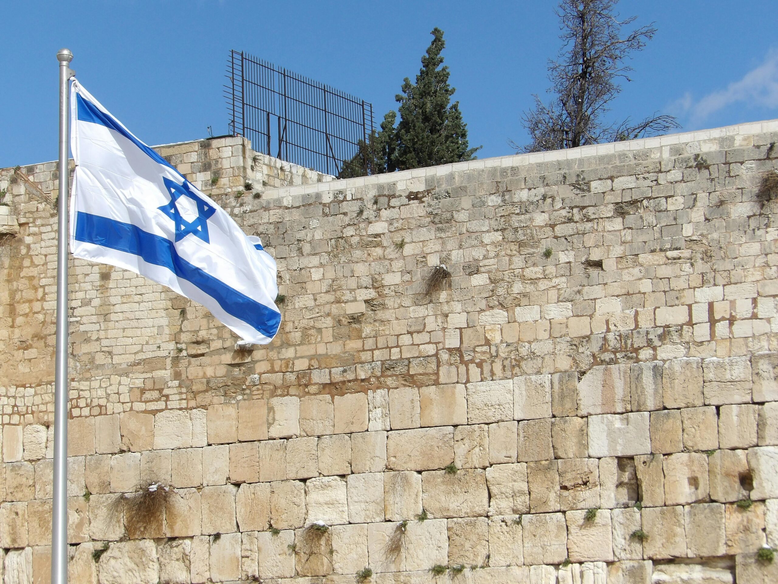 Israeli flag flying over the Western Wall or Kotel