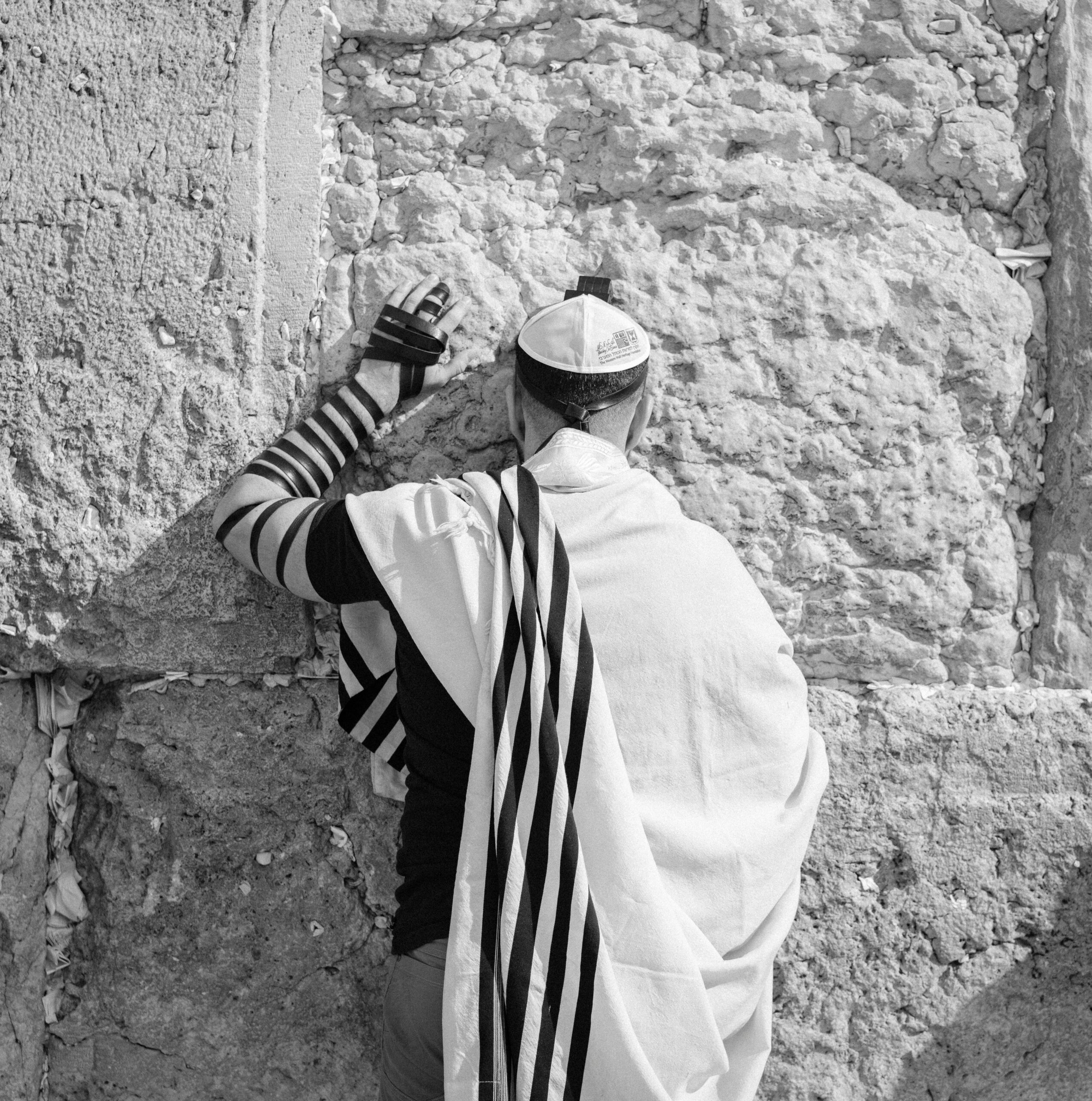 A Jewish man praying at the Western Wall or Kotel